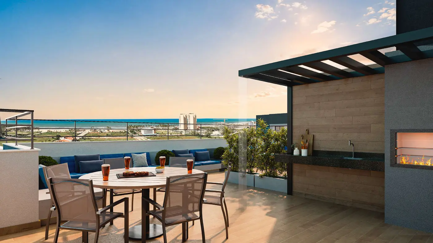 Rooftop com lounge externo e vista para o mar